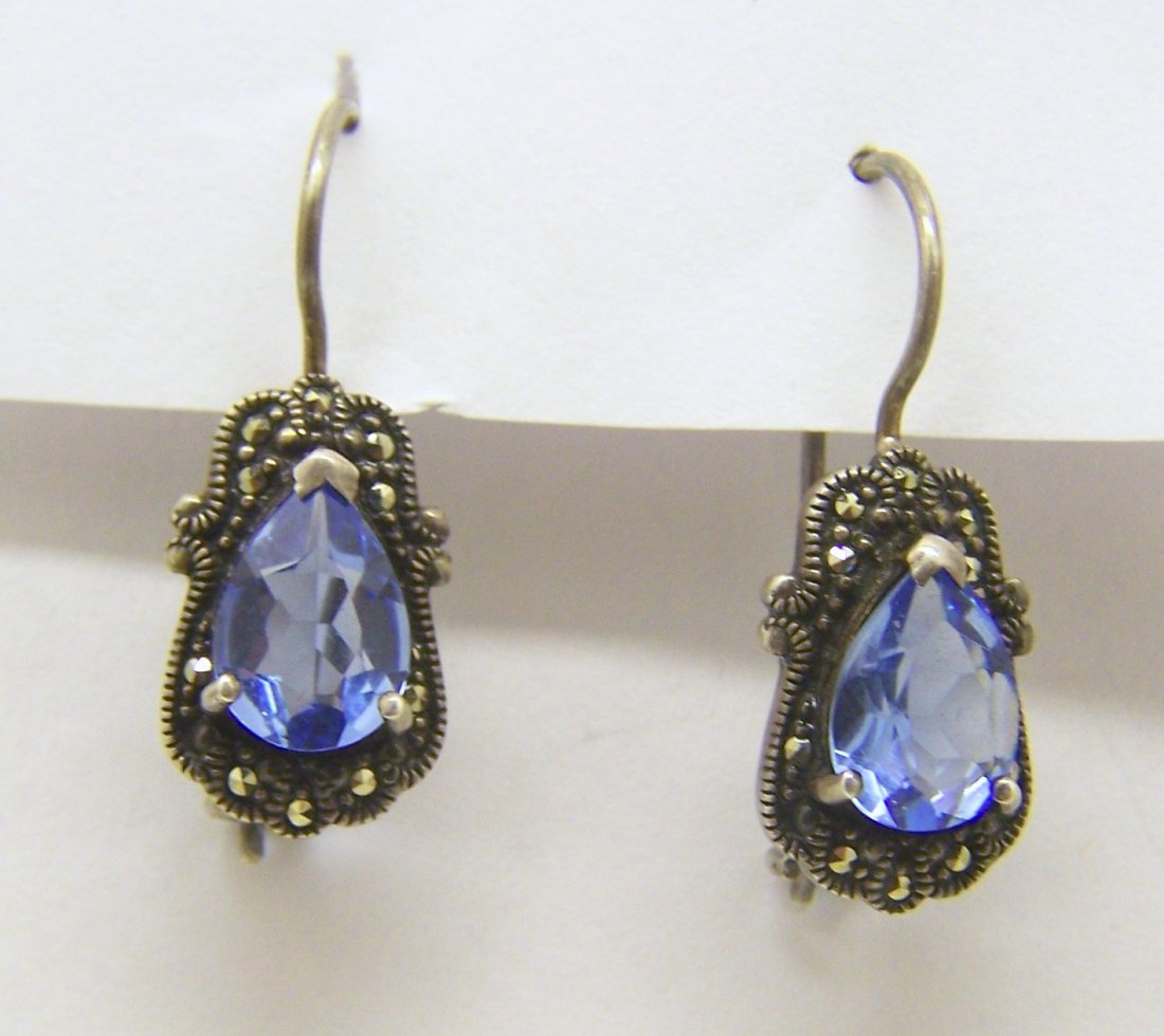 sterling silver marcasite topaz earrings: measures 1 1/16" long by 3/8" wide, cradted with 9x7mm topaz, weights 4.5 grams, in good condition