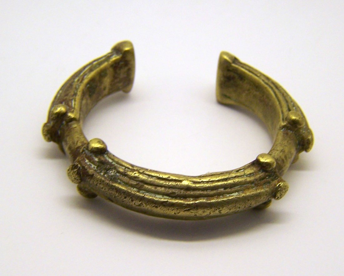 antique African brass cuff bracelet: can fit a 6 1/2" to 7 1/2" wrist by 11/316" wide, weights 151 grams, bracelet is in good condition justneed to be polish as you desire,