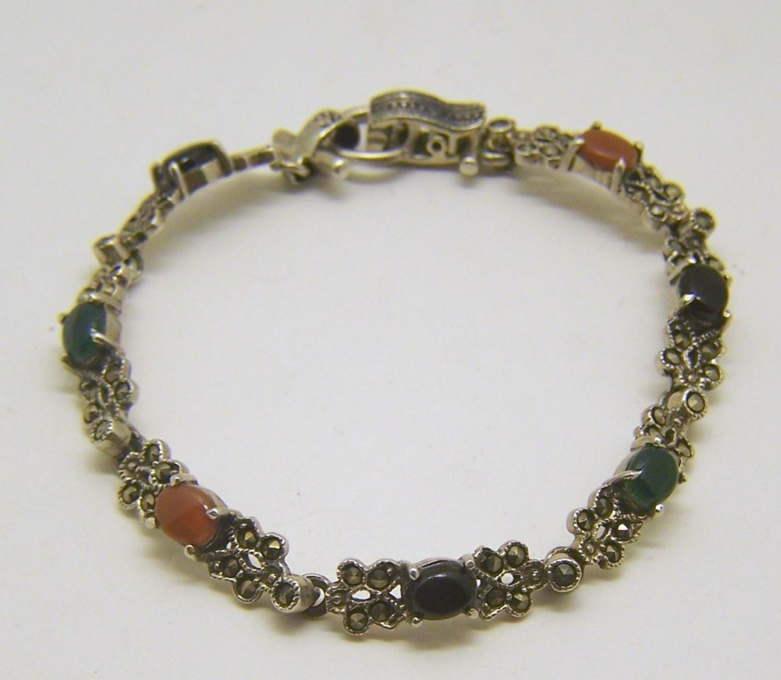 sterling silver gemstone marcasite bracelet: measures 7 1/2" long by 1/4" wide, crafted with 6x4mm onyx, agate, carnelian, weights 16.4 grams, in good condition