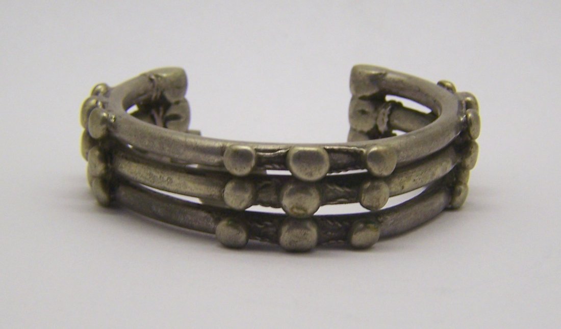 antique African 800 silver allow cuff bracelet: can fit a 6" to 7" wrist by 5/8" wide, weights 82.3 grams, bracelet is in good condition justneed to be polish as you desire, not sure if this bracelet is 800 or 700 ilver but test positive for silver