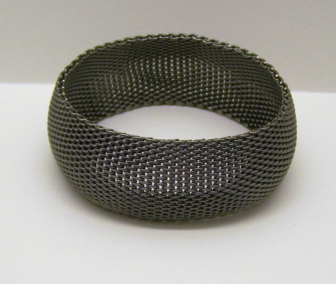 silver tone somerset bracelet: measures 7 7/8" inside circunference by 1 1/8" wide, weights 63.9 grams, in great condition,