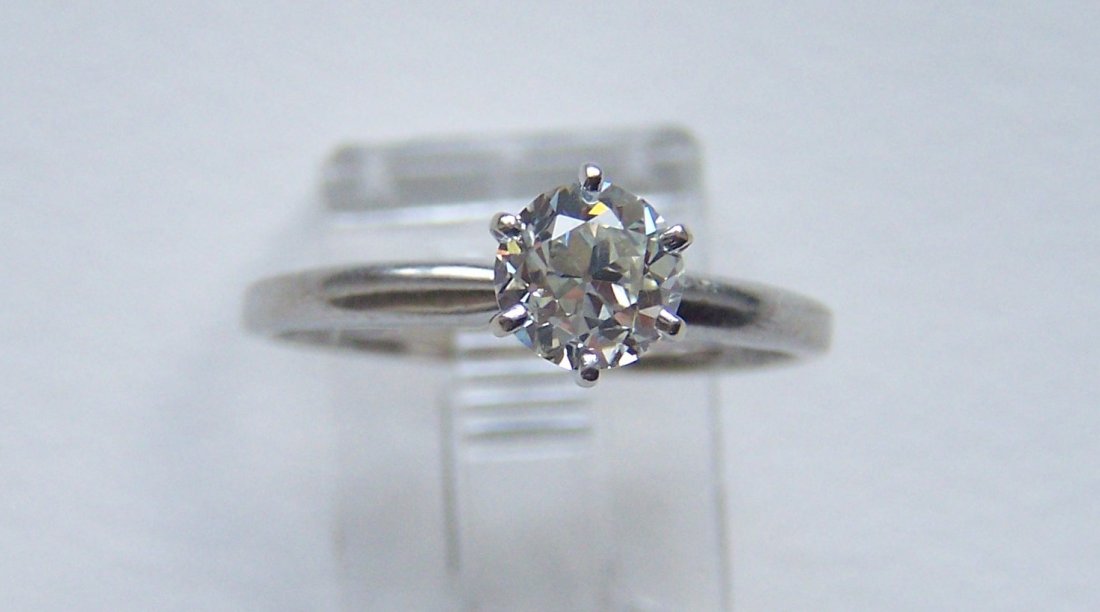 14k .90 Old European cut diamond solitaire ring: top of the ring measures 7mm and hold an .90 Ct. VS1 / D .90 old European cut diamond, weights 2.3 grams, size 8 ( but can be re-sized), in good condition the diamond is in good condition