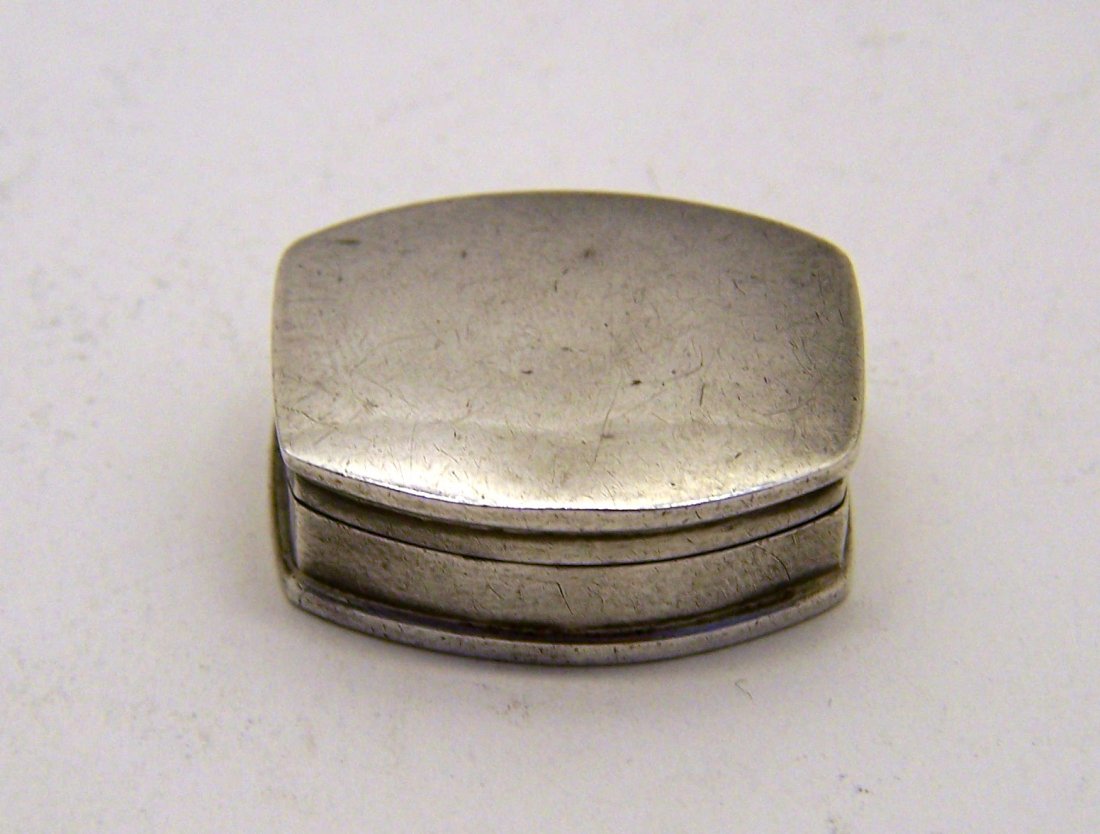 vintage sterling silver pill box: measures 1 1/8" long by 15/16" wide by 7/16" wide, weights 9.9 grams, in good condition
