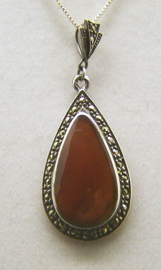 sterling silver marcasite carnelian pendant: measures 2" long by 13/16" wide, weights 5.6 grams, in good condition