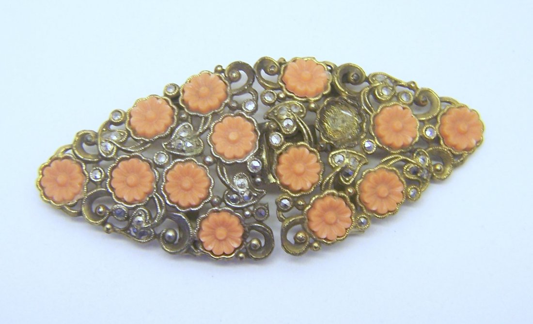 vintage gold gilt marcasite coral lucite belt buckle: measures 3 3/8" long by 1 1/2" wide, weights 27.6 grams, in good condition, missing a flower and sold tone have some wear