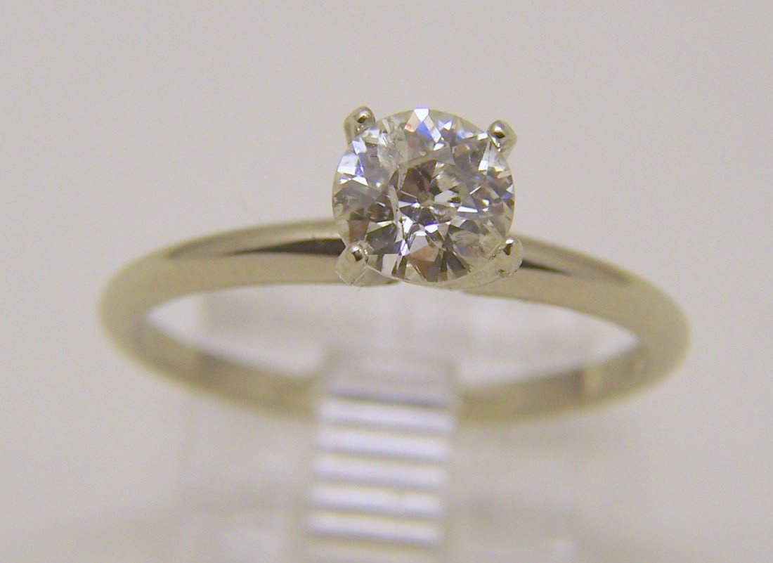 Vintage 14k .70 old european cut diamond solitaire ring: top of the ring measures 6.5mm wide, crafted with .70 ctw old european cut diamond SI3/I1 in clarity & F in color, diamond have a carbon & an natural fracture on the top, visible with an magnifiing, s