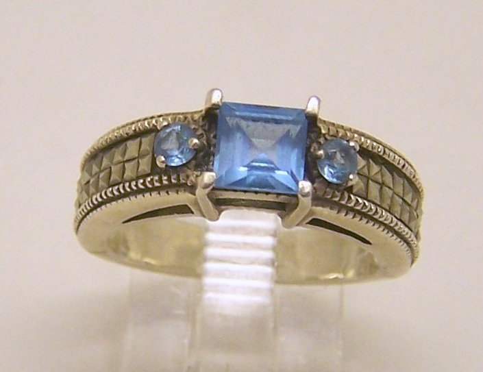JUDITH JACK sterling silver marcasite topaz ring: top of the ring measures 1/4" wide, size 6, weights 4.7 grams, in good condition