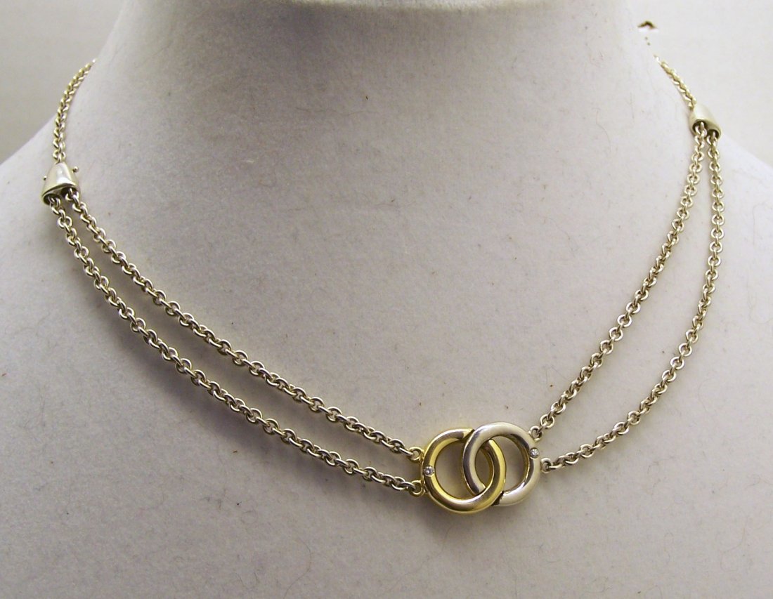 MOVADO sterling silver 18k diamond necklace: measures 16 1/4" long, weights 20.4 grams,in great condition