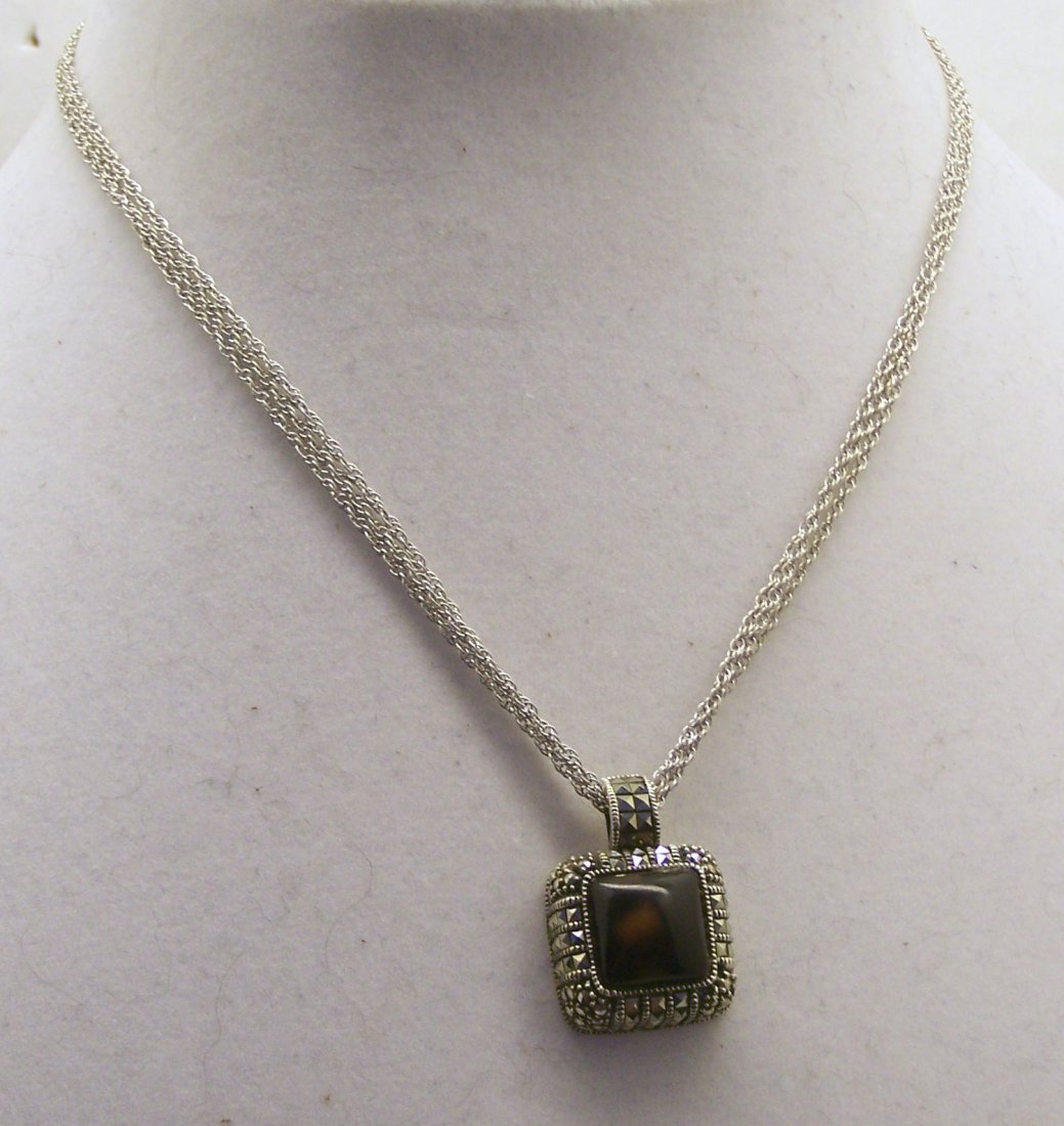 JUDITH JACK sterling silver marcasite pendant necklace: the chain measures 16" long & hold a 1 1/16" long pendant, weights 11.2 grams, in good condition