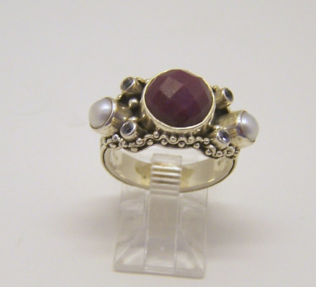 sterling silver ruby pearl topaz ring: top of the ring measures 1/2" wide, size 7, weights 7.3 grams, in good condition