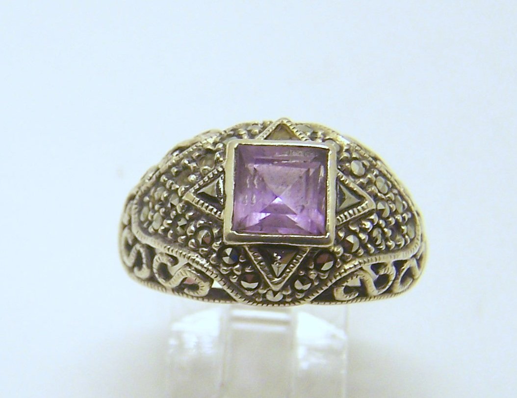 JUDITH JACK sterling silver amethyst marcasite ring: top of the ring measures 9/16" wide, size 7, weights 7.2 grams, in good condition