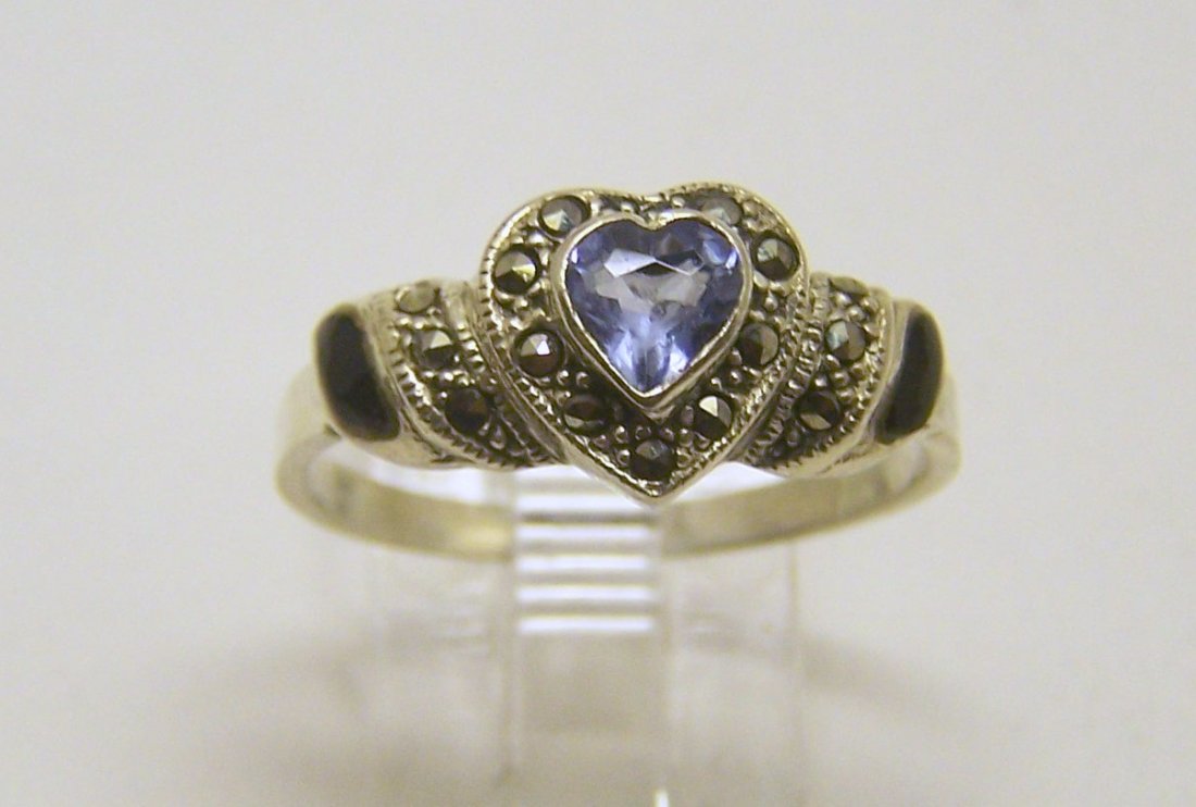 sterling silver topaz marcasite ring: top of the ring measures 3/8" wide, size 9 1/2, weights 2.6 grams, in good condition