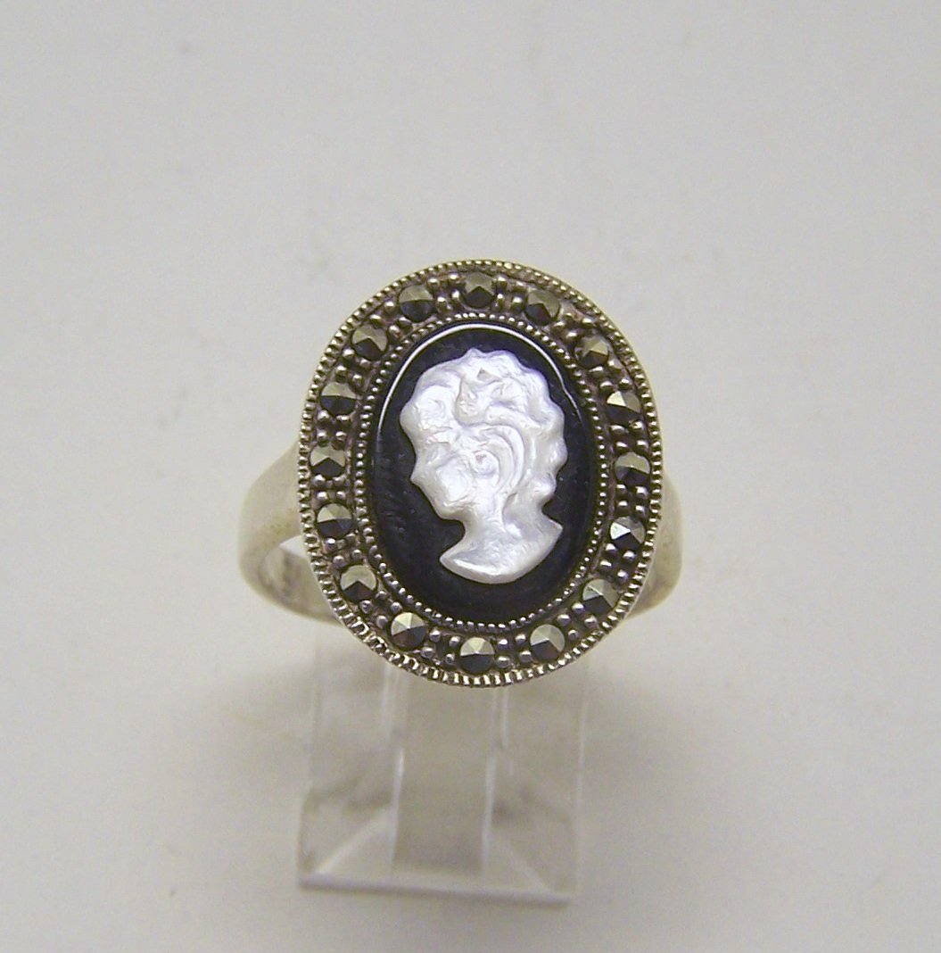 TM sterling silver cameo marcasite ring: top of the ring measures 13/16" wide, size 9 1/2, weights 5.6 grams, in good condition