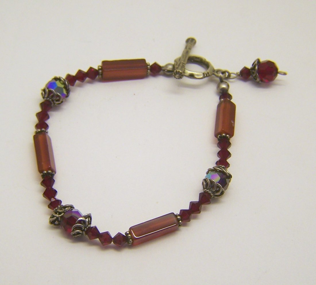 handcrafted carnelian crystal sterling bracelet: measures 7 1/2" long, weights 7.7 grams, in good condition