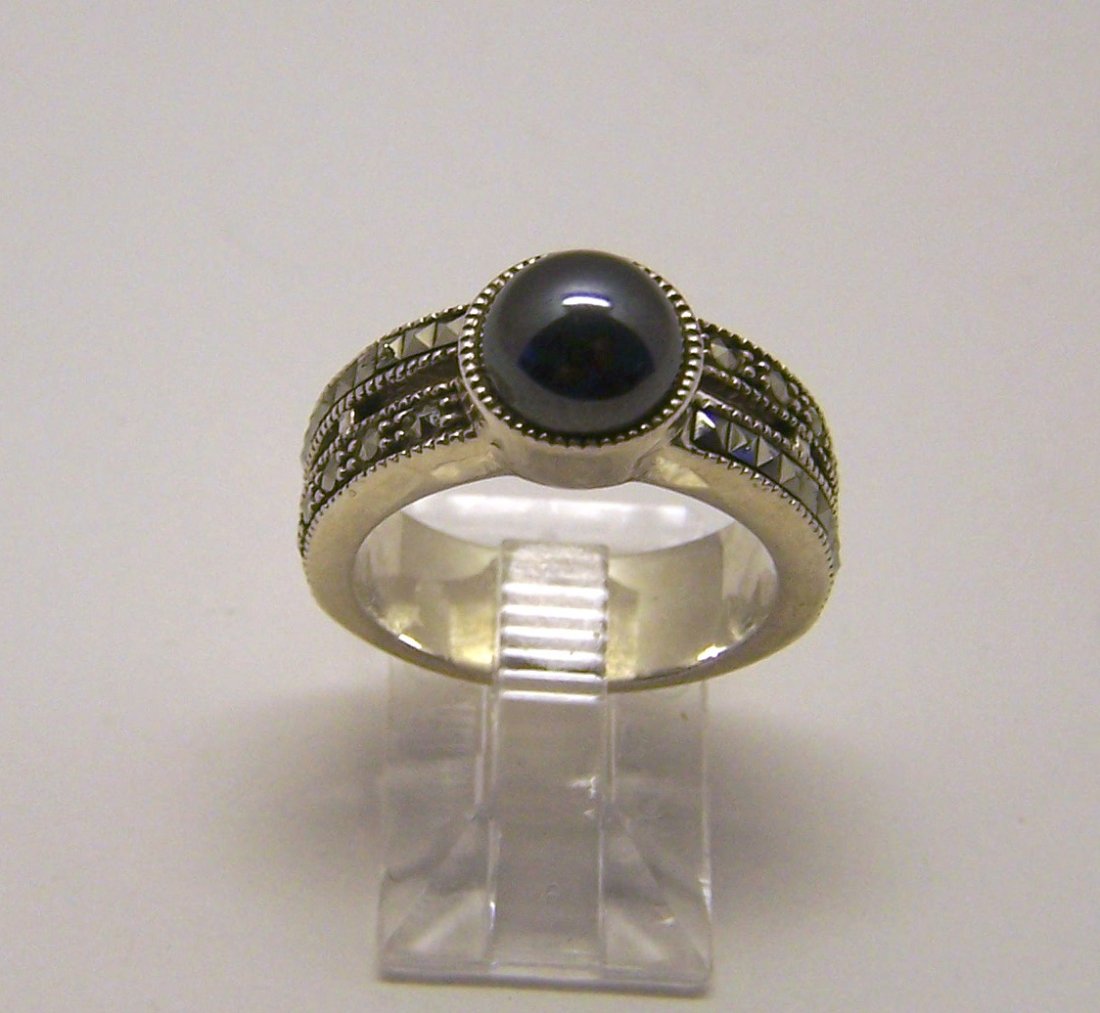 JUDITH JACK sterling silver marcasite ring: top of the ring measures 3/8" wide, size 6 3/4, weights 7.8 grams, in good condition