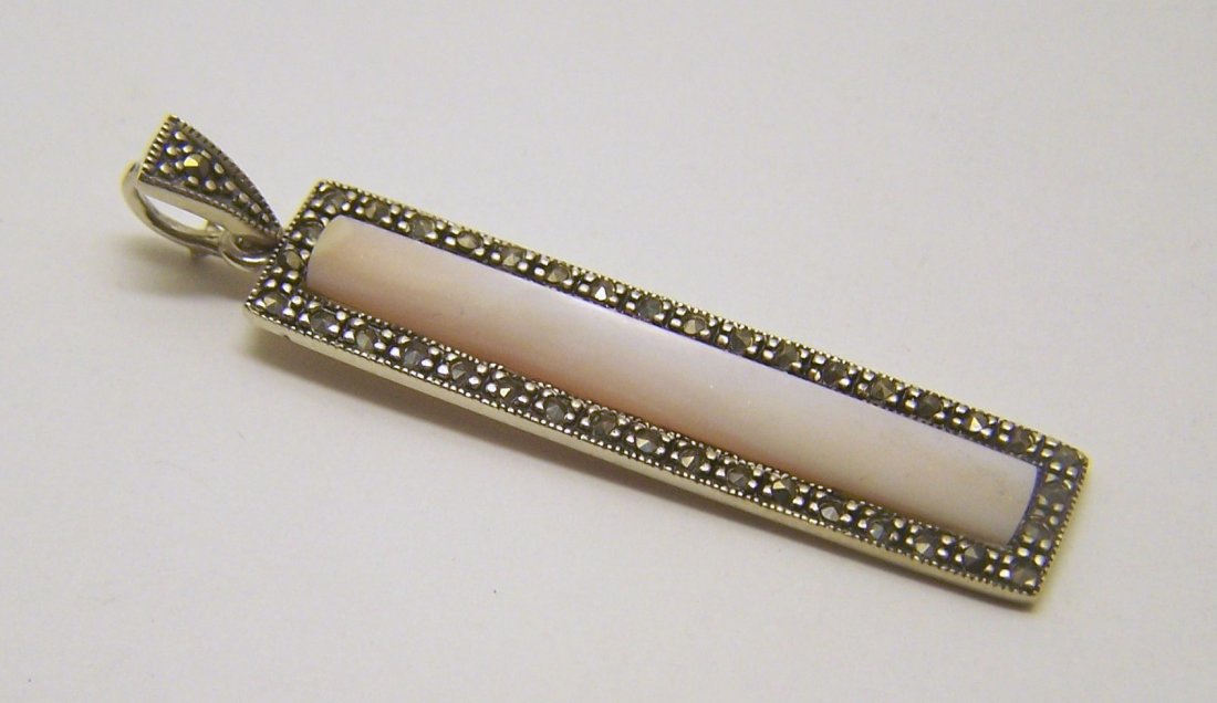 sterling silver marcasite mother pearl pendant: measures 2 1/8" long by 9/16" wide, weights 4.6 grams, in good condition