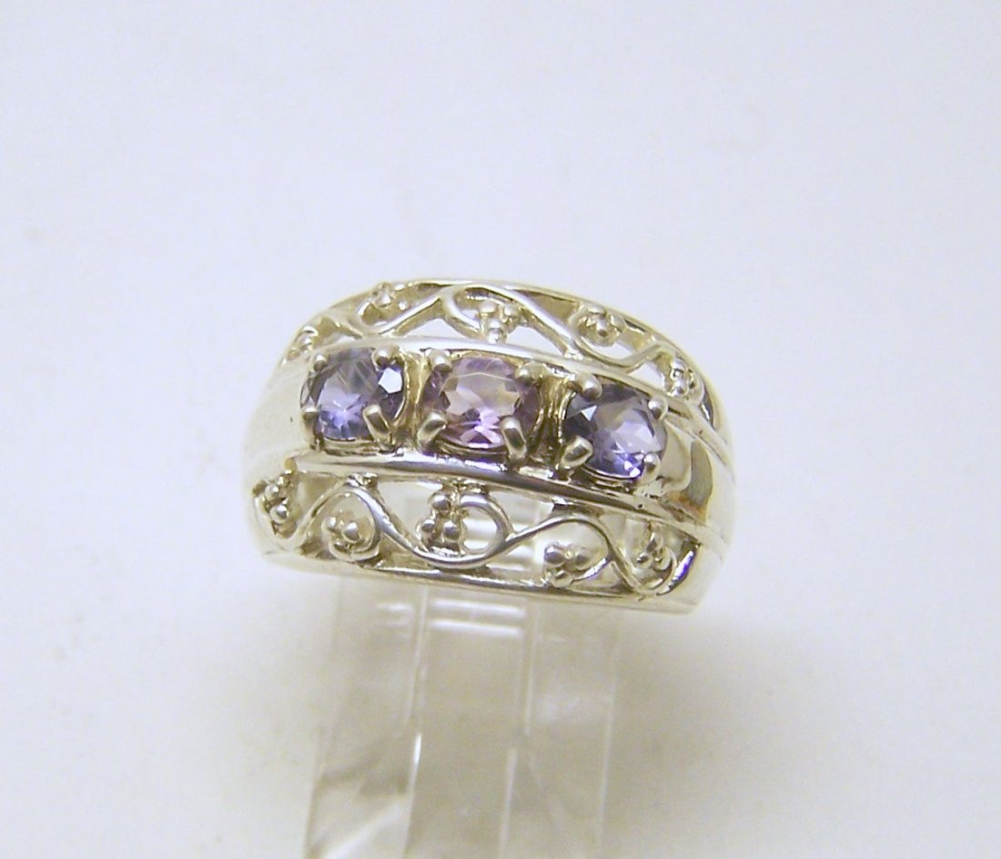 CNA sterling silver iolite ring: top of the ring measures 9/16" wide, size 7, weights 7.1 grams, in good condition