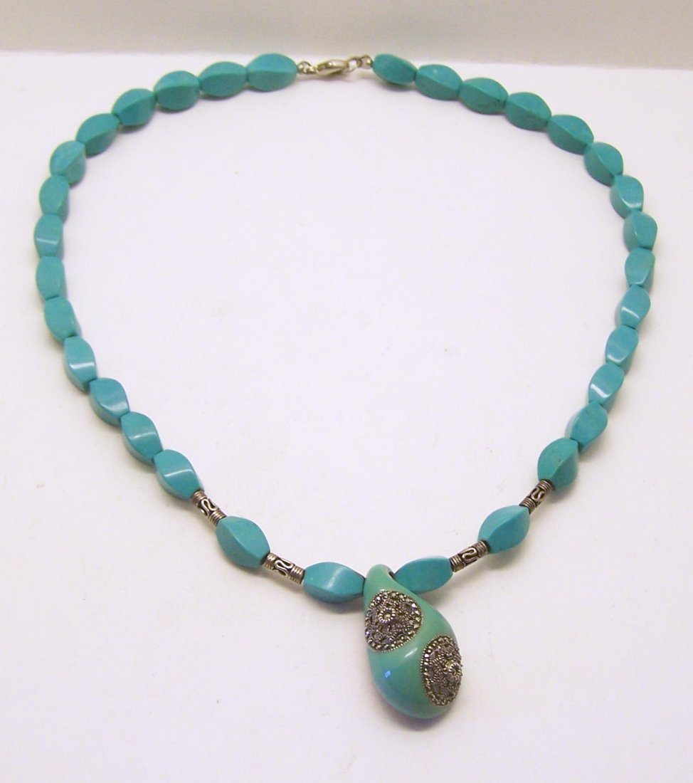 sterling silver turquoise marcasite necklace: measures 17 3/4" long, crafted with a 1 5/16" long pendant, 12x6mm turquoise, weights 39.2 grams, in great condition
