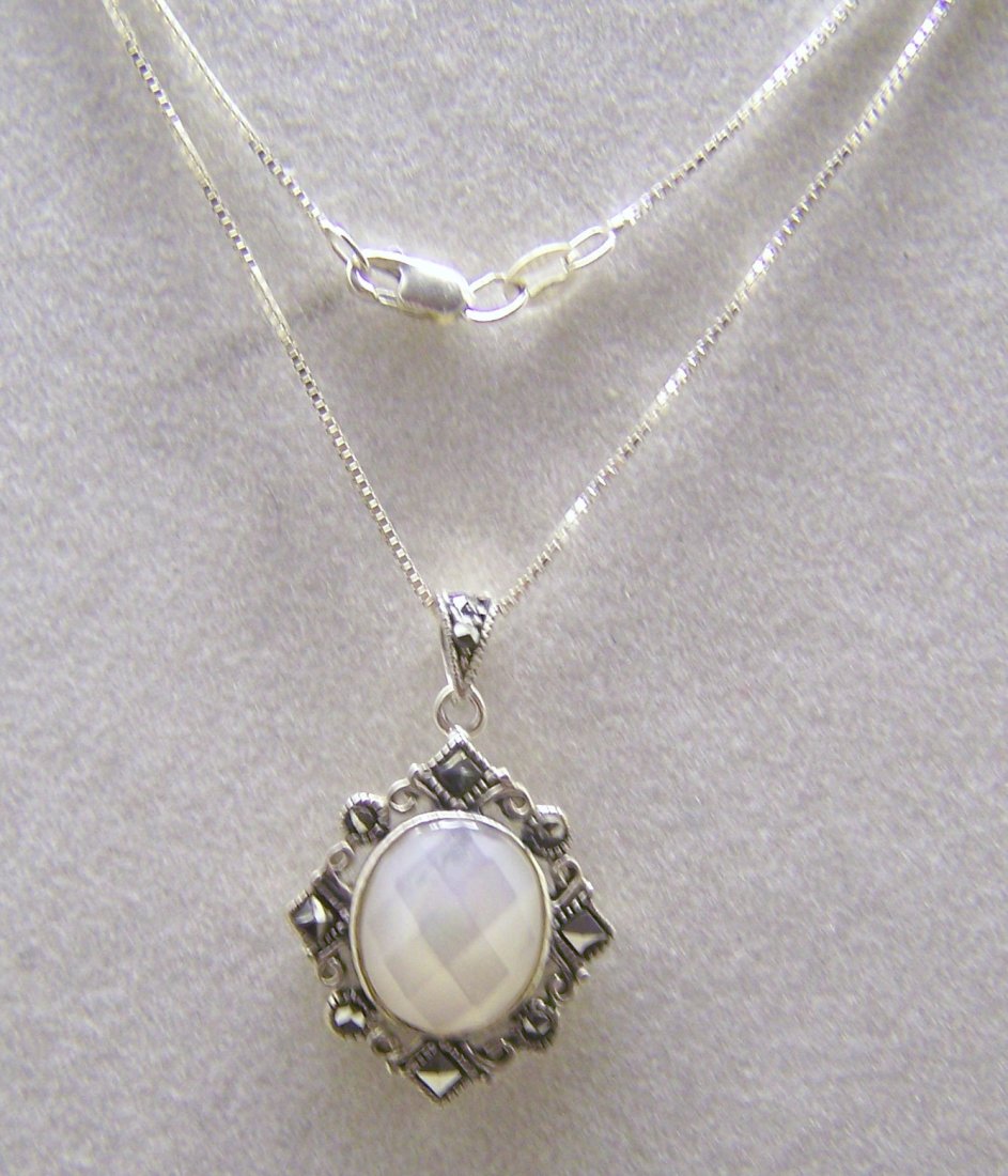 JC sterling silver mother pearl marcasite necklace: chain measures 18" long, pendant measures 1 3/16" long, weights 5.4 grams, in great condition