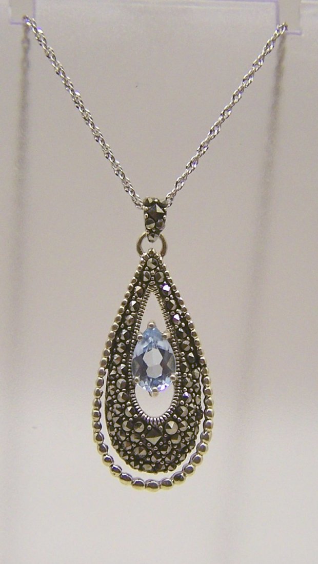 A sterling silver marcasite topaz necklace: chain measures 18" long, pendant measures 1 1/2" long, weights 6 grams, in great condition