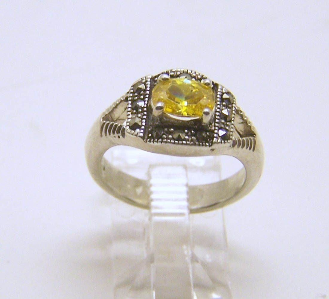 sterling silver CZ marcasite ring: top of the ring measures 5/16" wide, size 6 1/2, weights 5.7 grams, in great condition