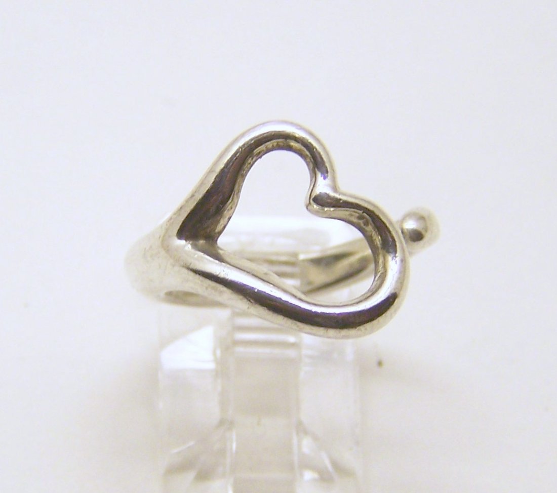 TIFFANY & Co Elsa Peretti sterling silver ring: top of the ring measures 9/16" wide, size 6 1/2, weights 5.1 grams, in good condition