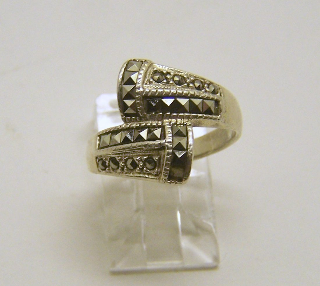 A sterling silver marcasite ring: top of the ring measures 5/8" wide, size 6, weights 3.6 grams, in good condition