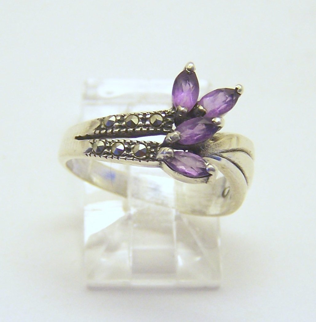 sterling silver marcasite amethyst ring: top of the ring measures 7/16" wide, size 6, weights 2.7 grams, in good condition