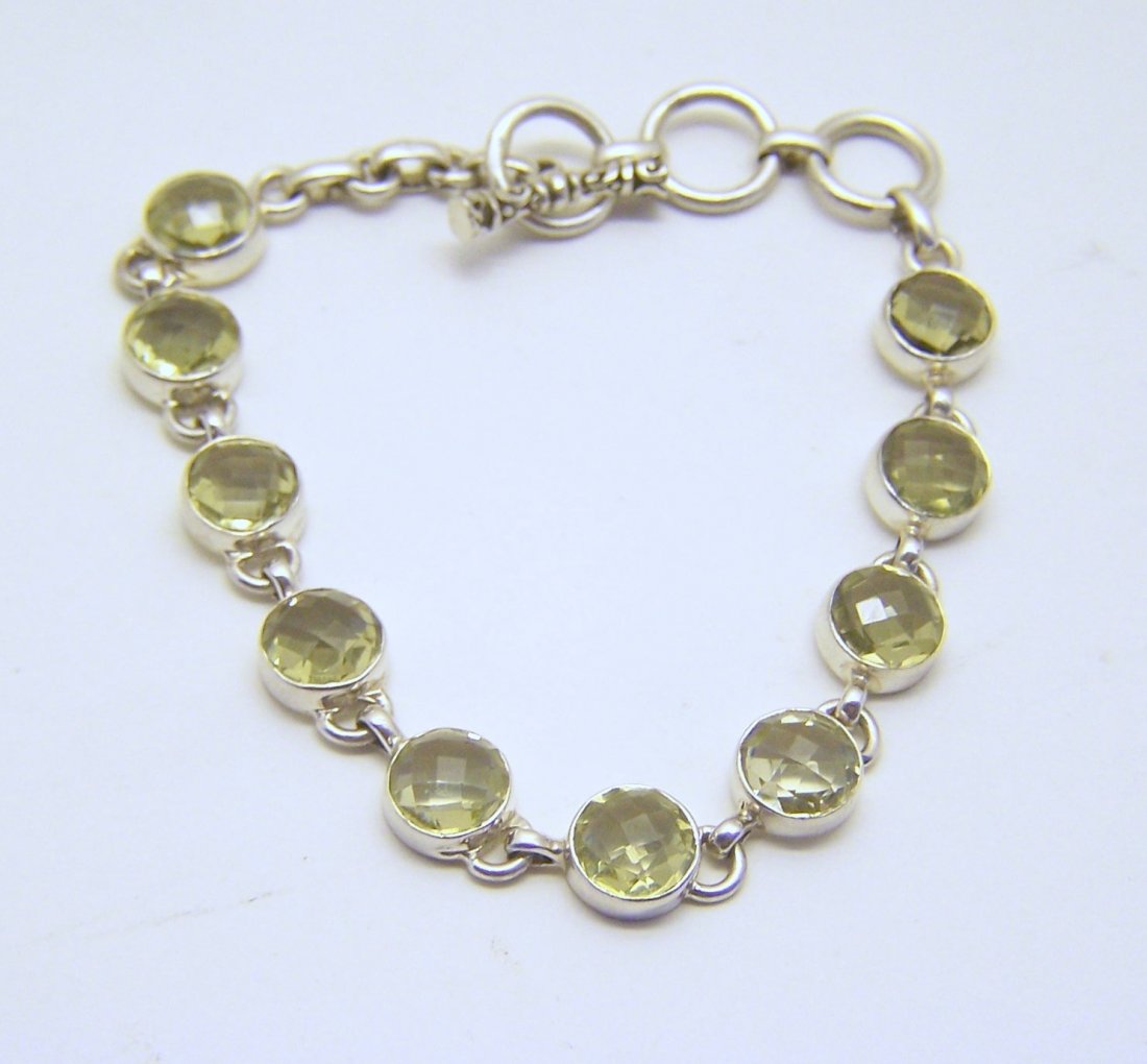 sterling silver lemon citrine bracelet: measures 7 7/8" long by 3/8" wide, weights 14.5 grams, in good condition