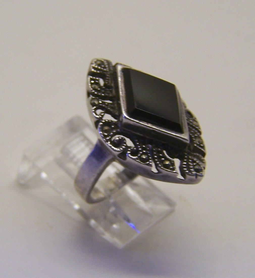 FAS sterling silver onyx marcasite ring: top of the ring measures 1" wide, size 6, weights 6.4 grams, in good condition