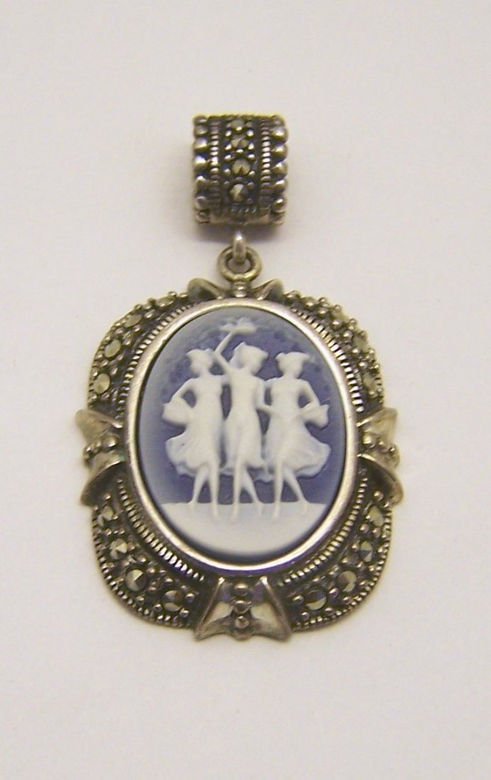 sterling silver charlcedony marcasite cameo pendant: measures 1 5/8" long by 15/16" wide. weights 8.7 grams, in good condition