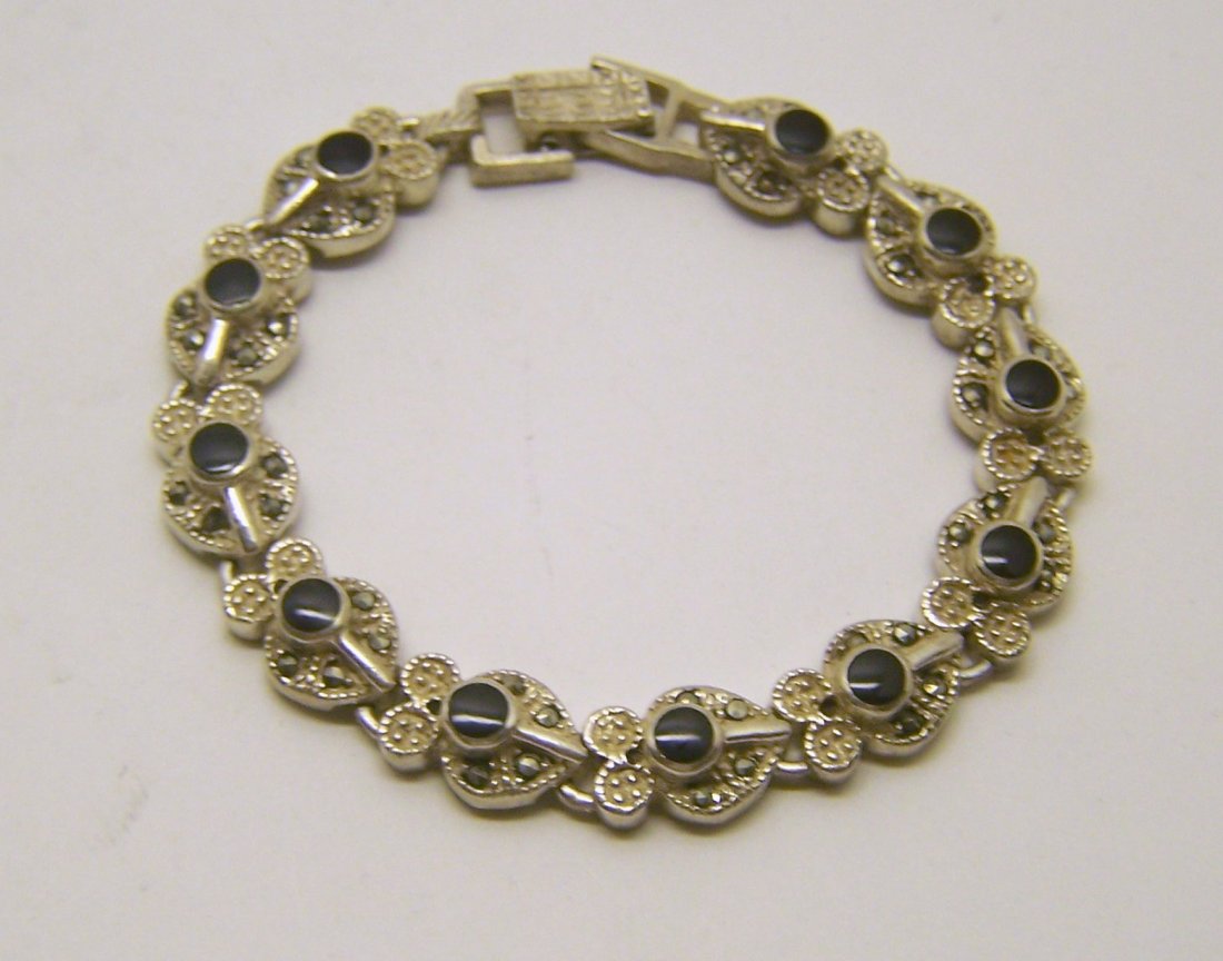 sterling silver marcasite bracelet: measures 7 1/8" long by 3/8" wide, weights 21 grams, in good condition