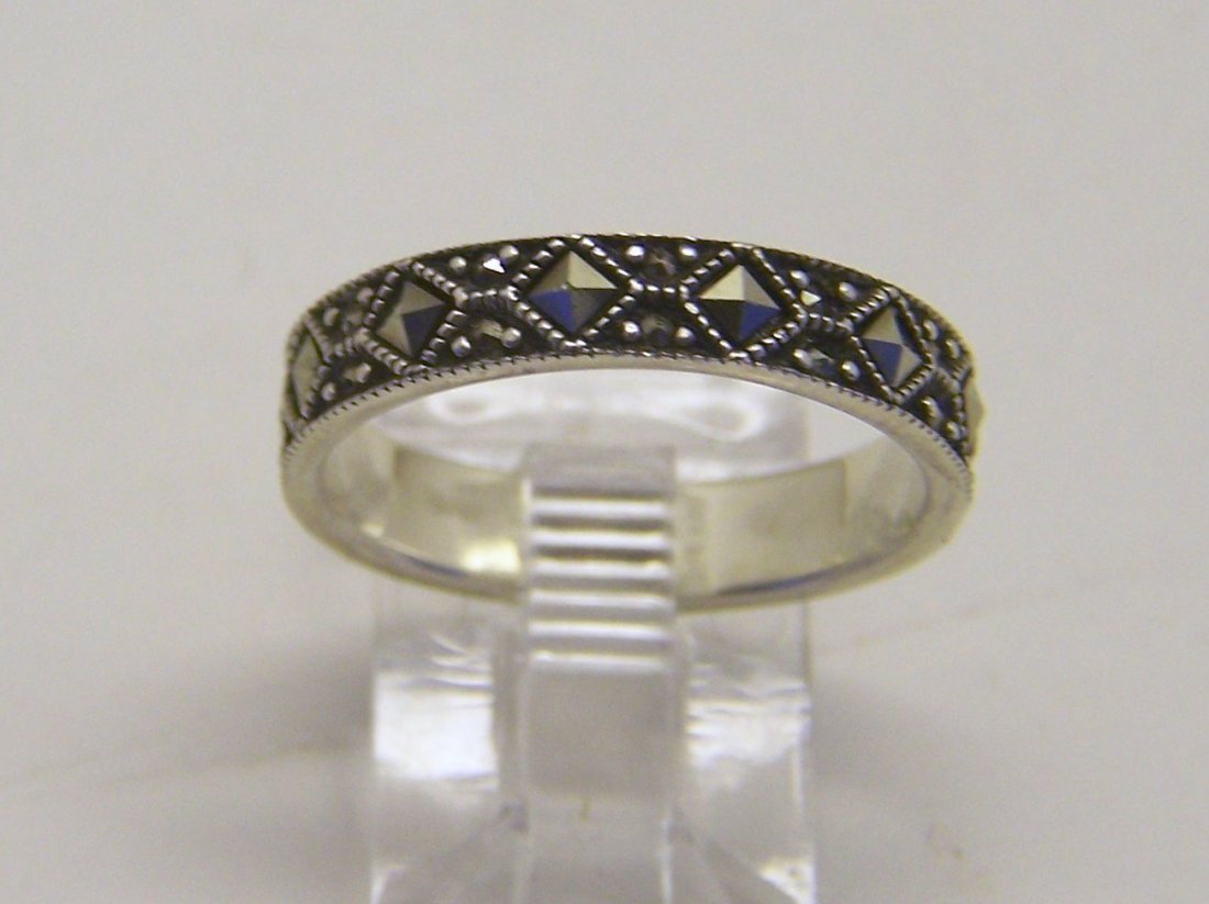 A sterling silver marcasite ring: top of the ring measures 3/16" wide, size 8, weights 2.8 grams, in good condition