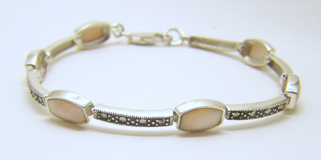 sterling silver marcasite mother pearl bracelet: measures 8" long by 5/16" wide, weights 13 grams, in good condition