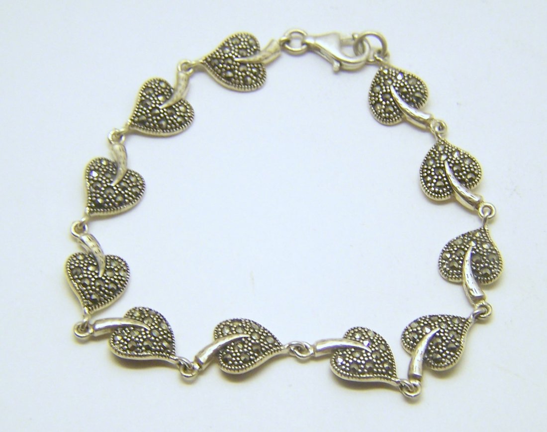 FAS sterling silver marcasite bracelet: measures 1/2" long by 3/8" wide, weights 8.9 grams, in good condition