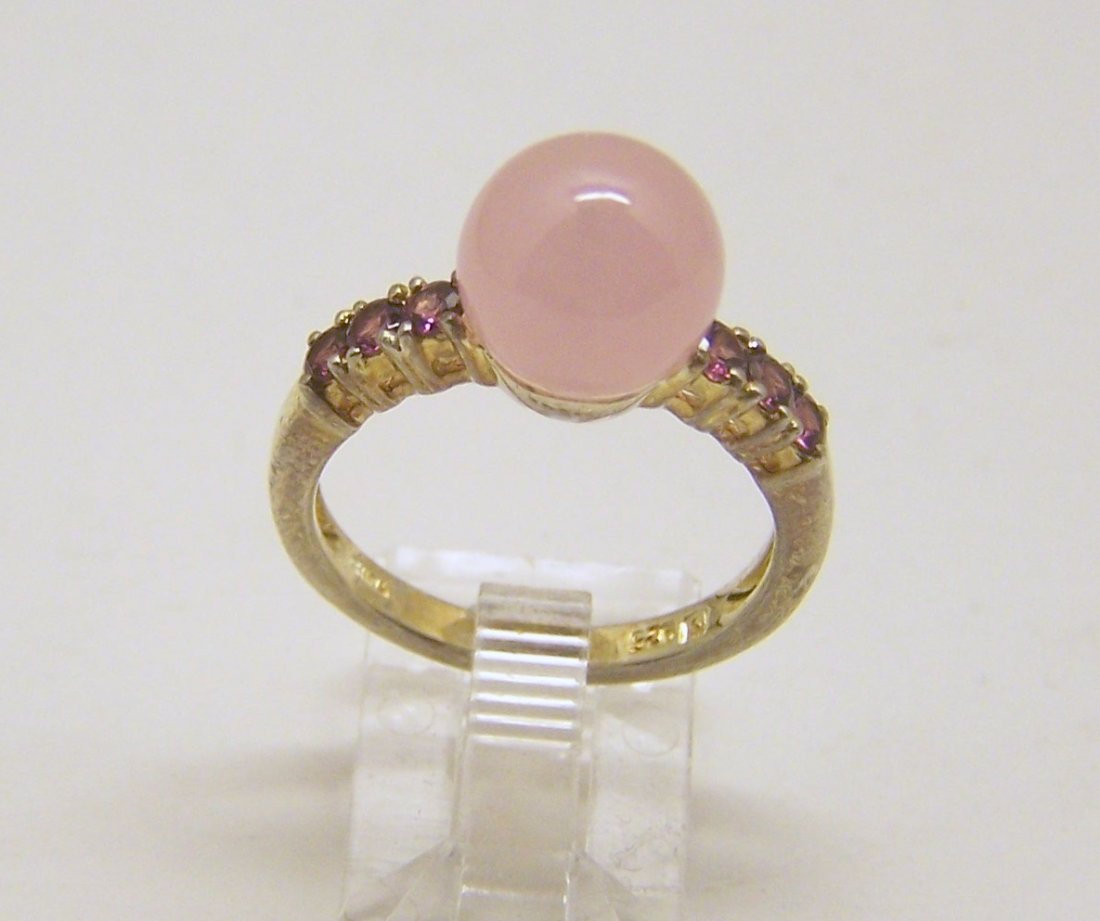 designer sterling silver ruby rose quartz ring: top of the ring measures 3/8" wide, size 8 1/4, weights 4.8 grams, in good condition