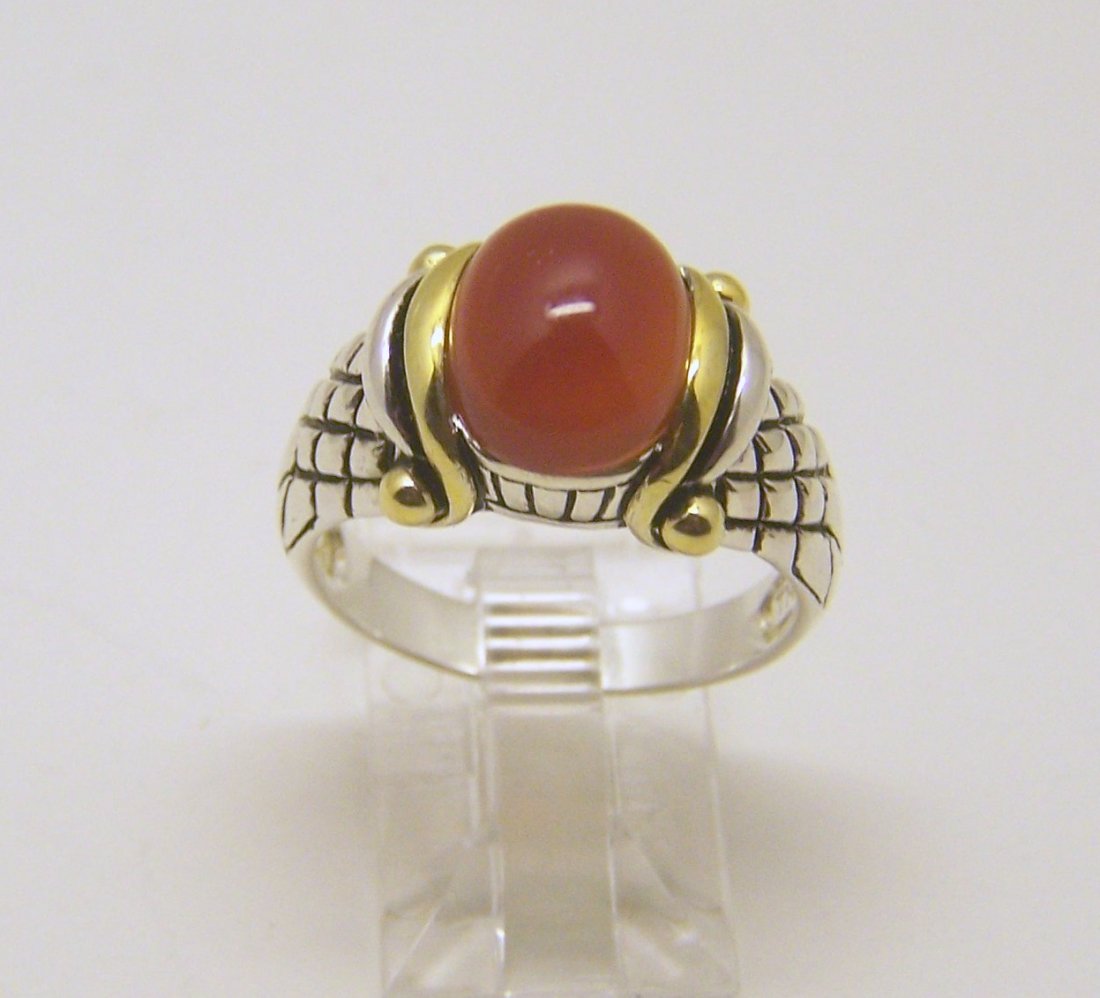 NF sterling silver carnelian ring: top of the rings measures 1/2" wide, size 8 1/4, weights 5.6 grams, in good condition