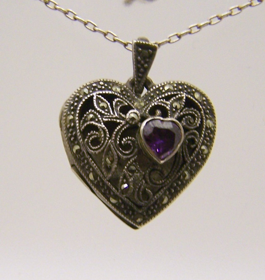 sterling silver amethyst marcasite locket pendant: measures 1 3/16" long by 15/16" wide, weights 11.2 grams, in great condition