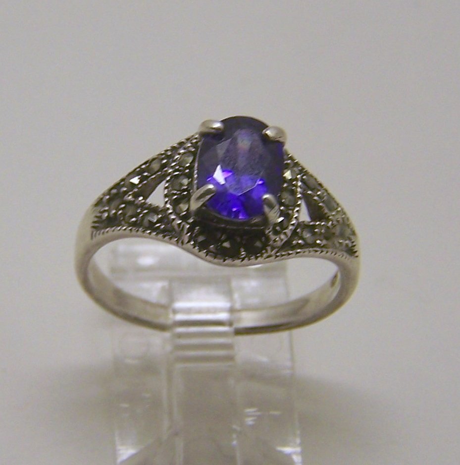 sterling silver amethyst marcasite ring: top of the ring measures 7/16" wide, size 8, weights 3.4 grams, in good condition