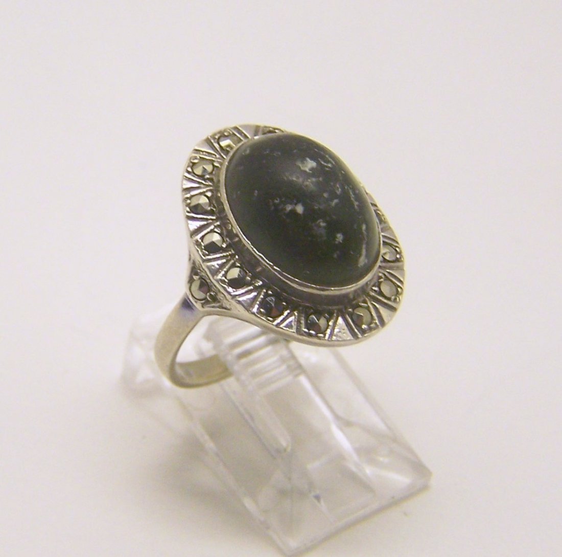 sterling silver jadeite marcasite ring: top of the rings measures 13/16" wide, size 6 1/2, weights 5.6 grams, in good condition