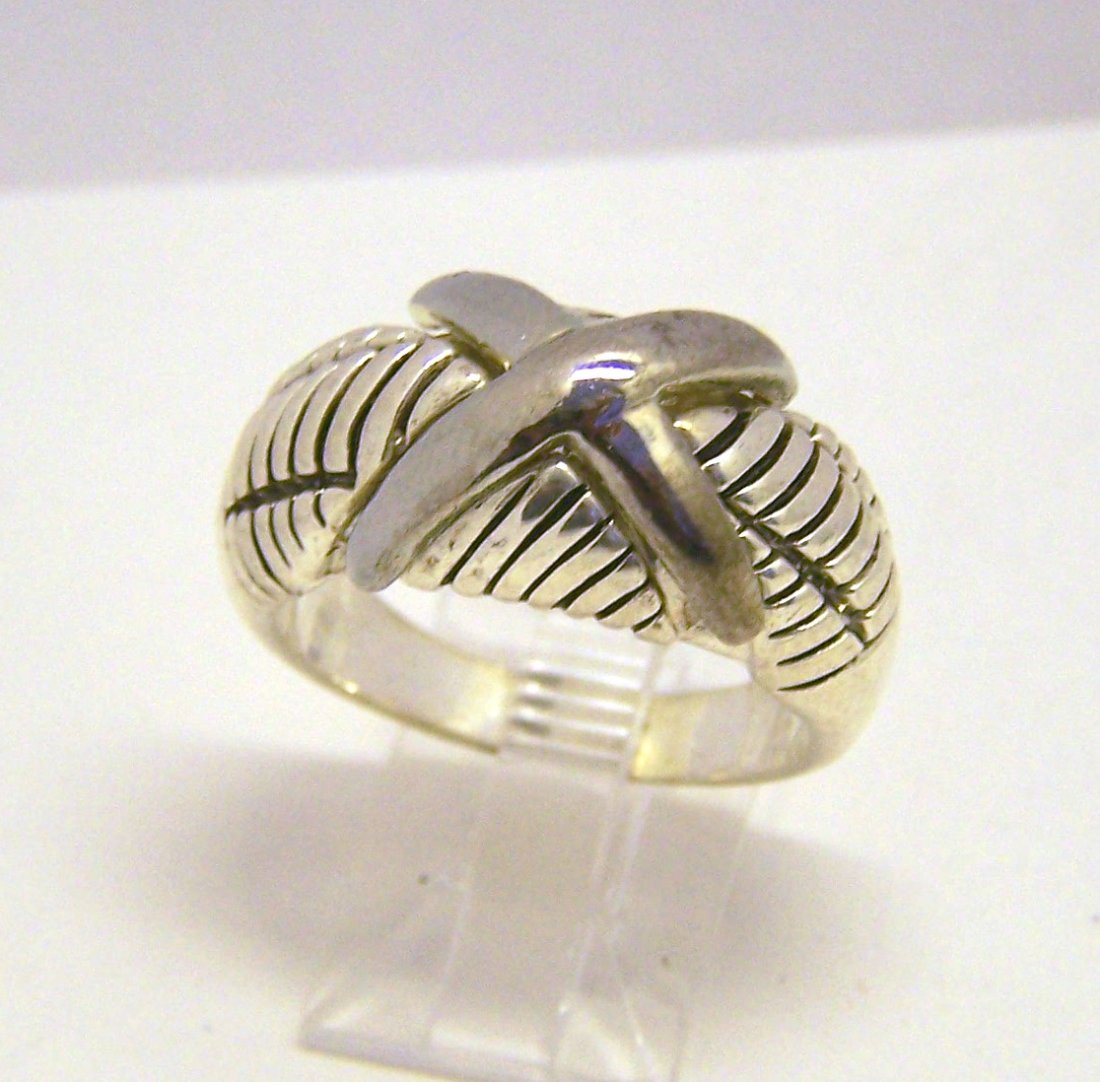 silver tone ring: top of the ring measures 9/16" wide, size 9 1/4" wide, weights 12.4 grams, in good condition
