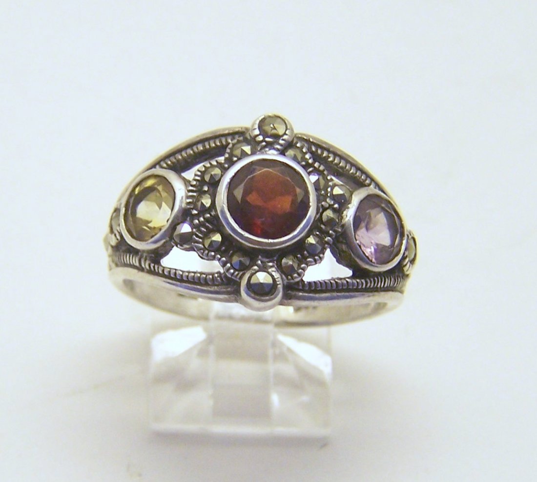 sterling silver garnet citrine amethyts marcasite ring: top of the ring measures 9/16" wide, size 9, weights 5.3 grams, in good condition