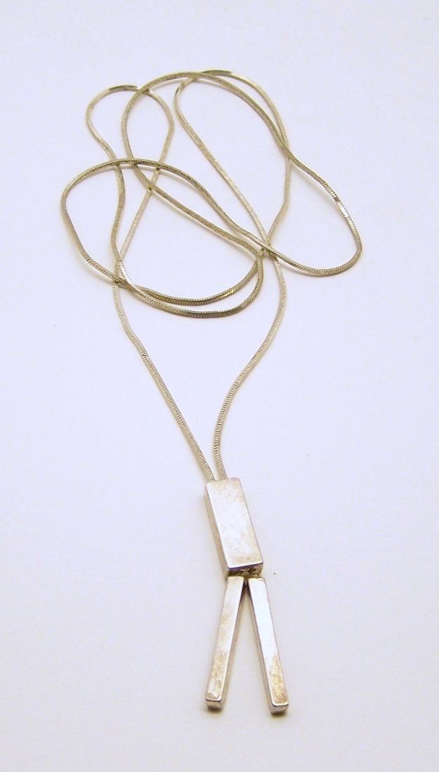 silver tone drop necklace: measures 27" long, weights 11 grams, in good condition