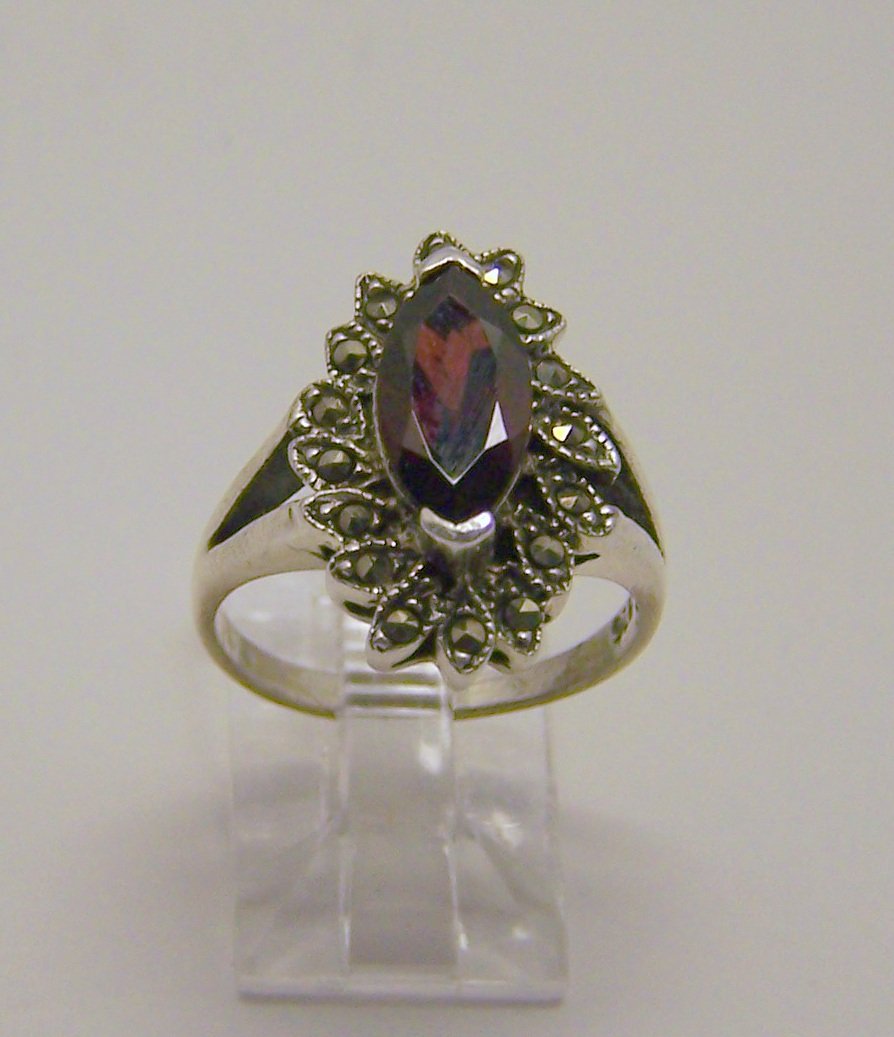 sterling silver marcasite garnet ring: top of the ring measures 13/16" wide, weights 5 grams, size 7, in good condition