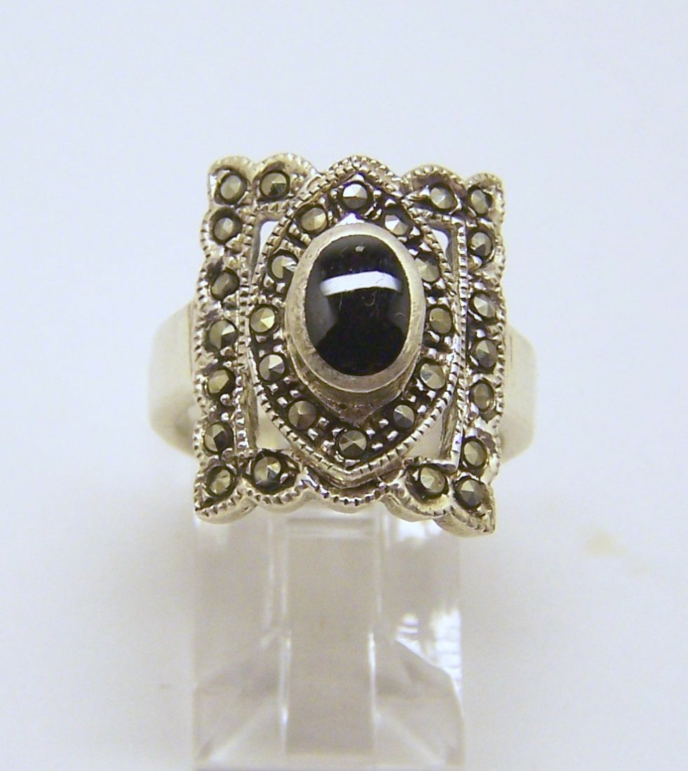 FAS sterling silver marcasite onyx ring: top of the ring measures 11/16" wide, size 6, weights 6.5 grams, in good condition