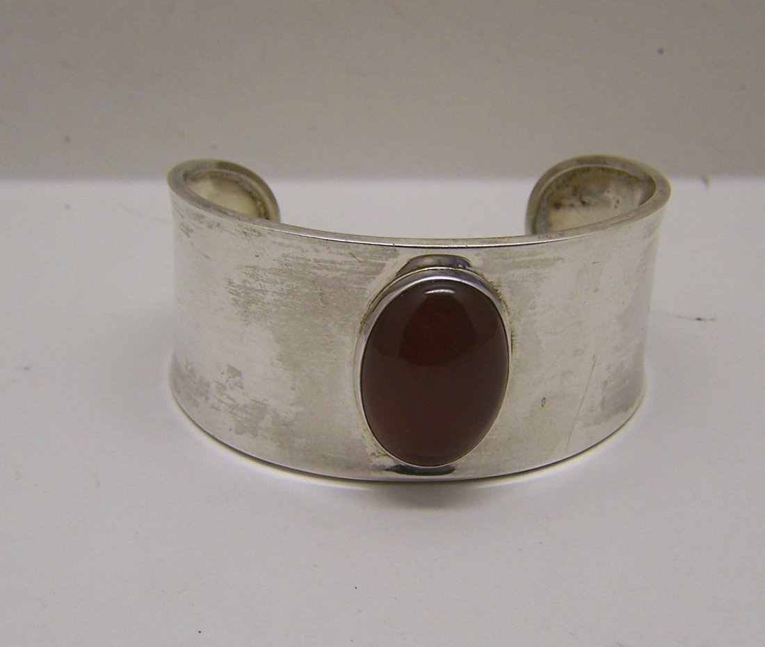 CII sterling silver carnelian cuff bracelet: will fit a 7 1/2" wrist by 1 5/16" wide, weights 27.3 grams, in good condition