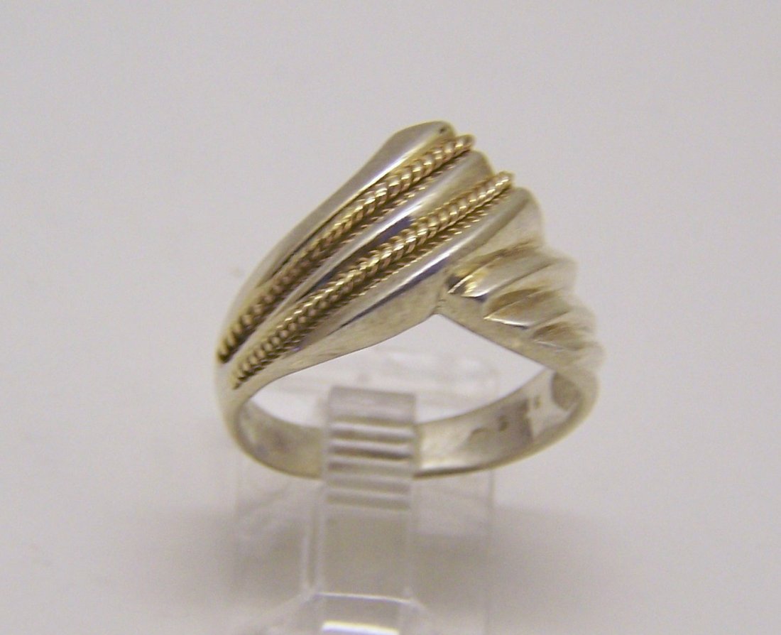 sterling silver 10k gold ring: top of the ring measures 1/2" wide, size 6 1/4, weights 4.2 grams, in good condition