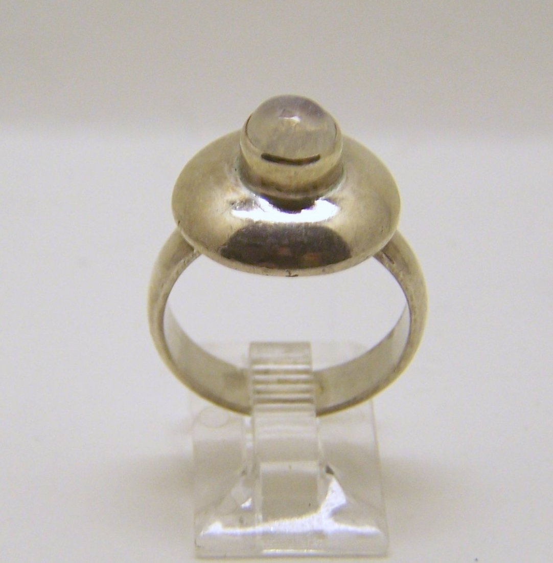 sterling silver moonstone ring: top of the ring measures 5/8" wide, size 7 1/4, weights 5.5 grams, in good condition