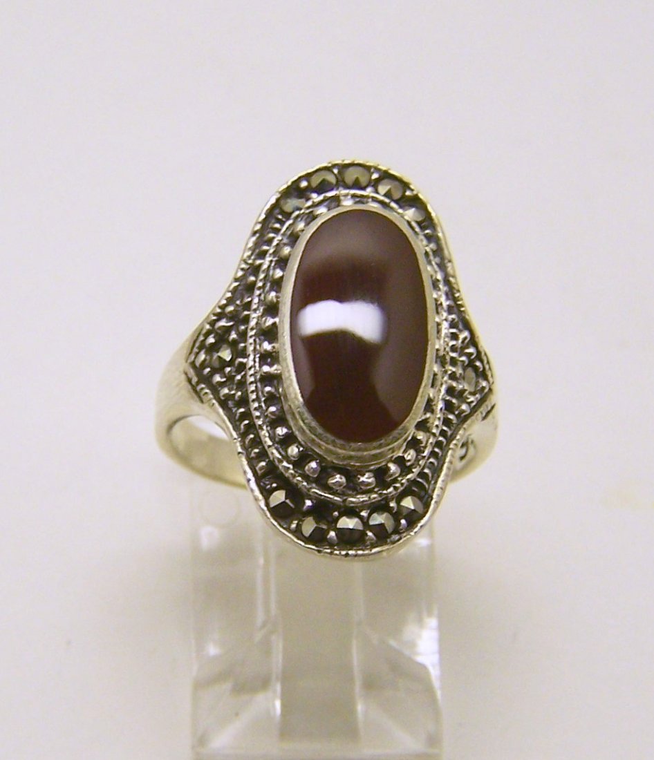 DN sterling silver marcasite carnelian ring: top of the ring measures 7/8" wide, size 5 3/4, weights 5.4 grams, in good condition
