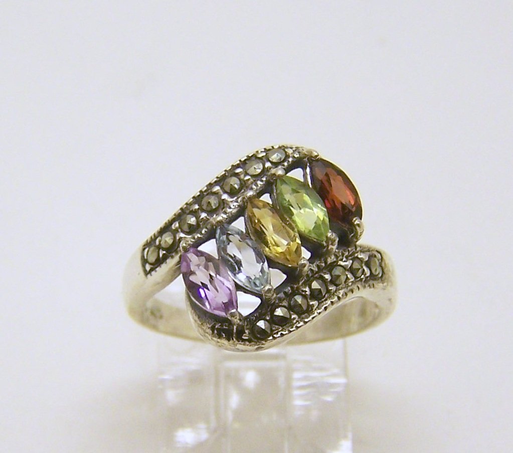 sterling silver marcasite gemstone ring: top of the ring measures 9/16" wide, size 5 3/4, weights 2.9 grams, in good condition